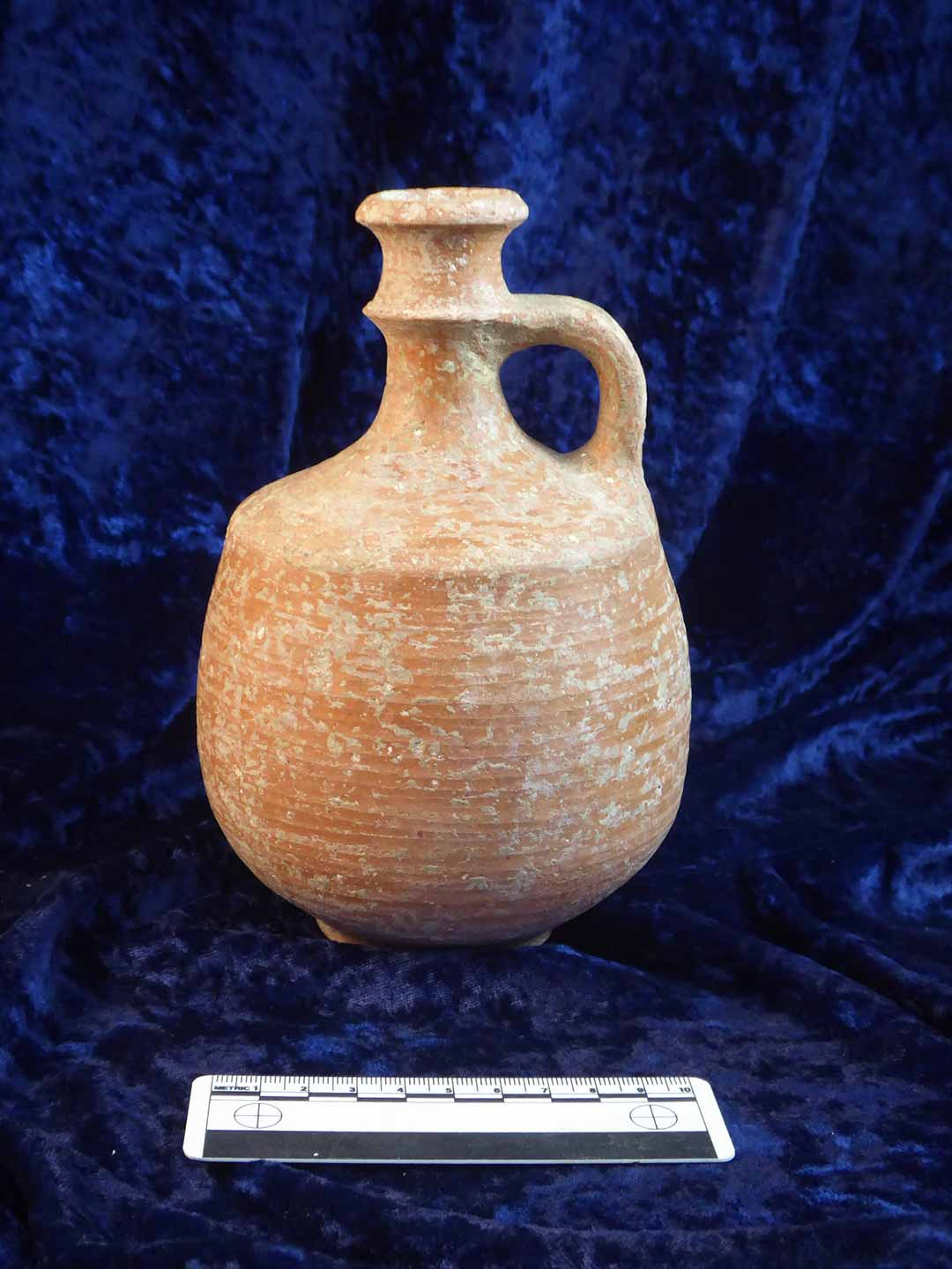  Ancient pottery flask on display