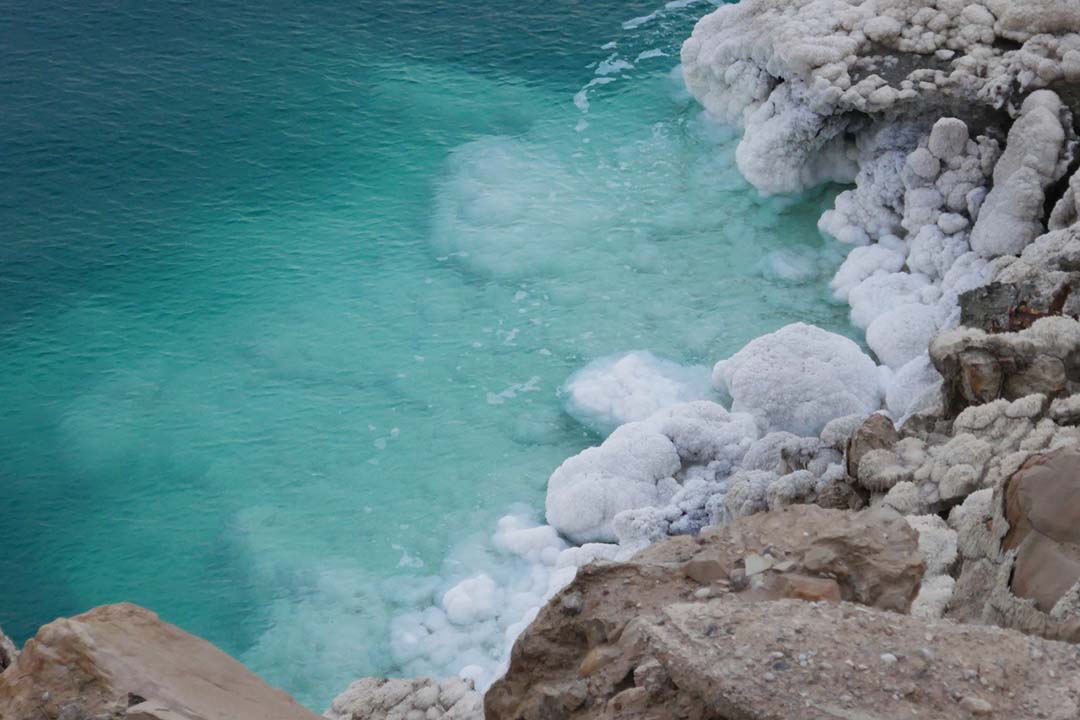 Salty deposits on the shore of the Dead Sea