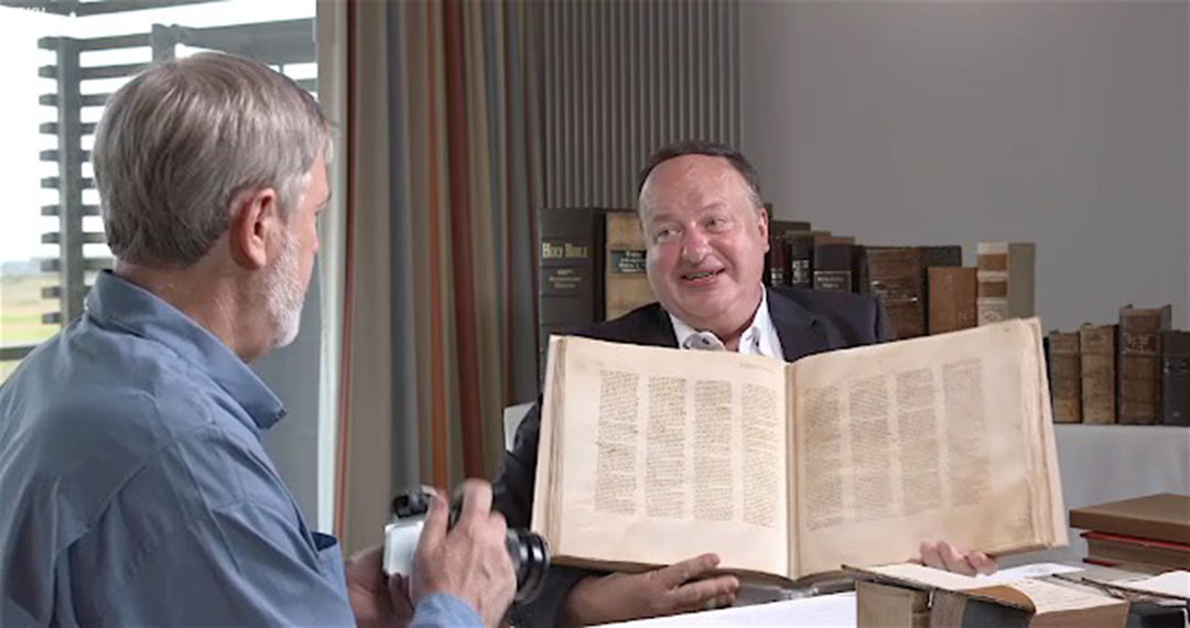 Alexander Schick and Timothy Mahoney examine a reproduction of the Codex Sinaiticus